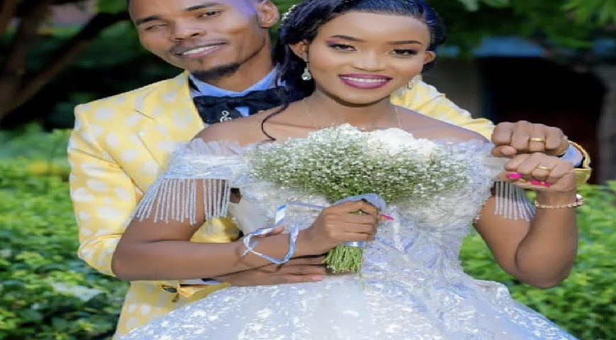 Stephen Kasolo and wife during their wedding